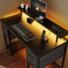 47-Inch Gaming Desk with LED Lights, Power Outlets, and 4 Drawers for Home Office and Bedroom Use in Black